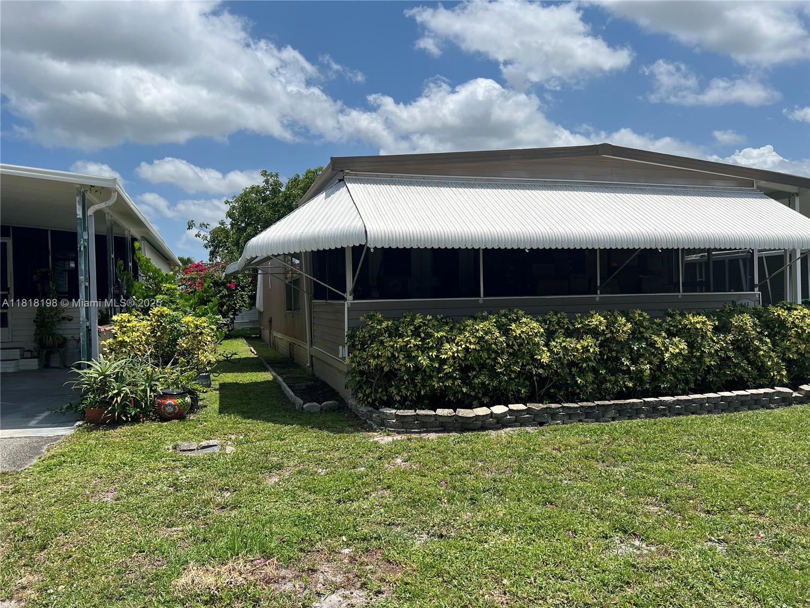 Davie Davie, FL 33324 - Photo 3 of 25 a front view of a house with a yard