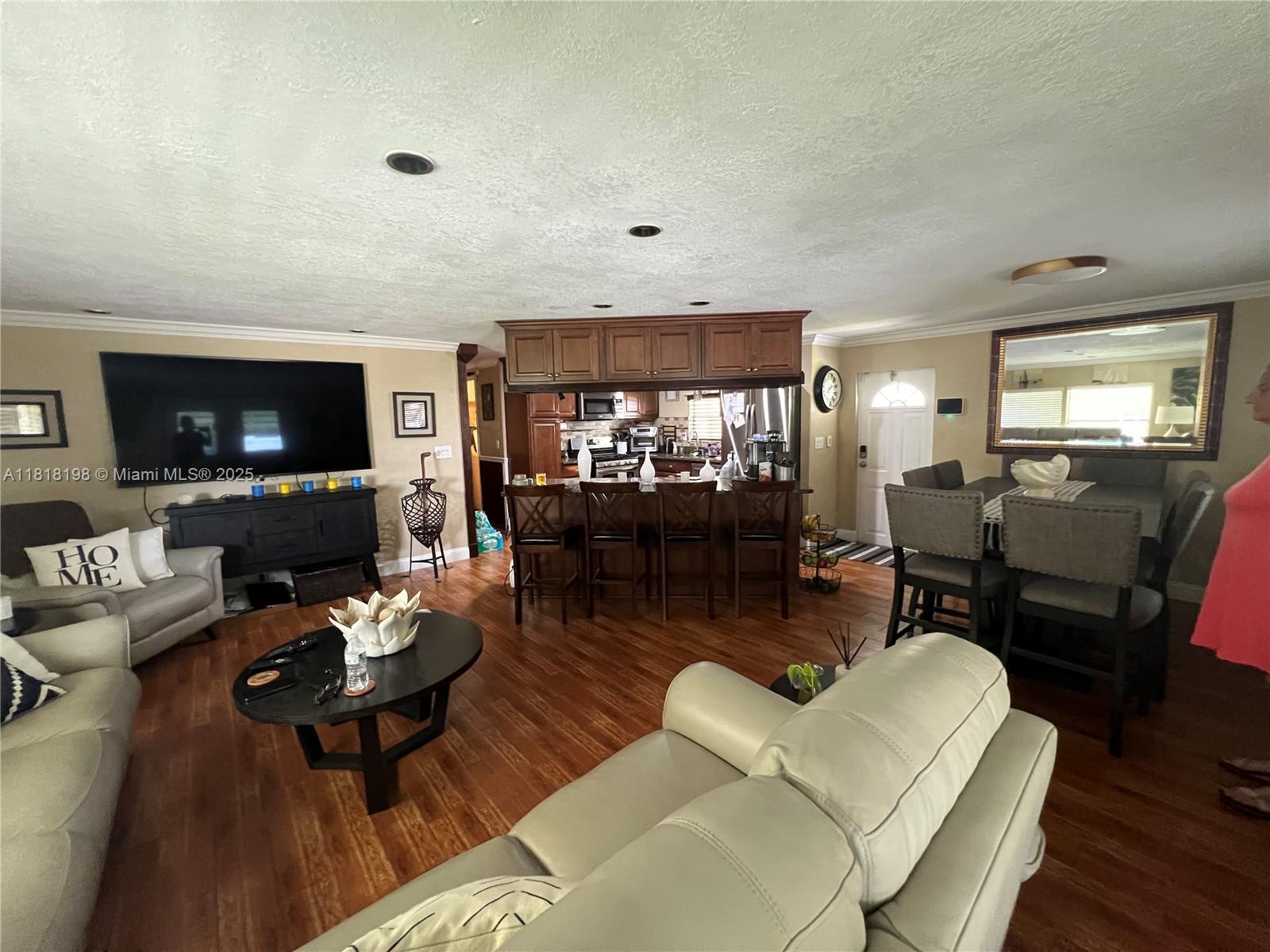 Davie Davie, FL 33324 - Photo 9 of 25 a living room with furniture and a flat screen tv