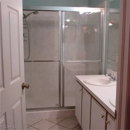 a white toilet sitting next to a bathroom sink