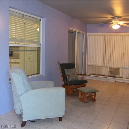 a view of a room with large windows and a couch