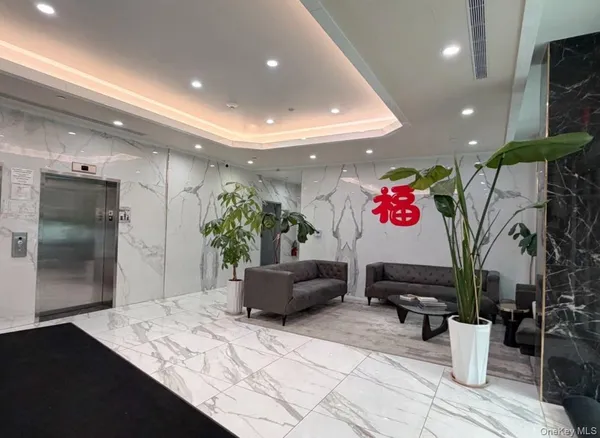 a kitchen with stainless steel appliances kitchen island granite countertop a refrigerator and a sink