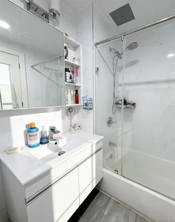 a bathroom with a sink double vanity and a bathtub