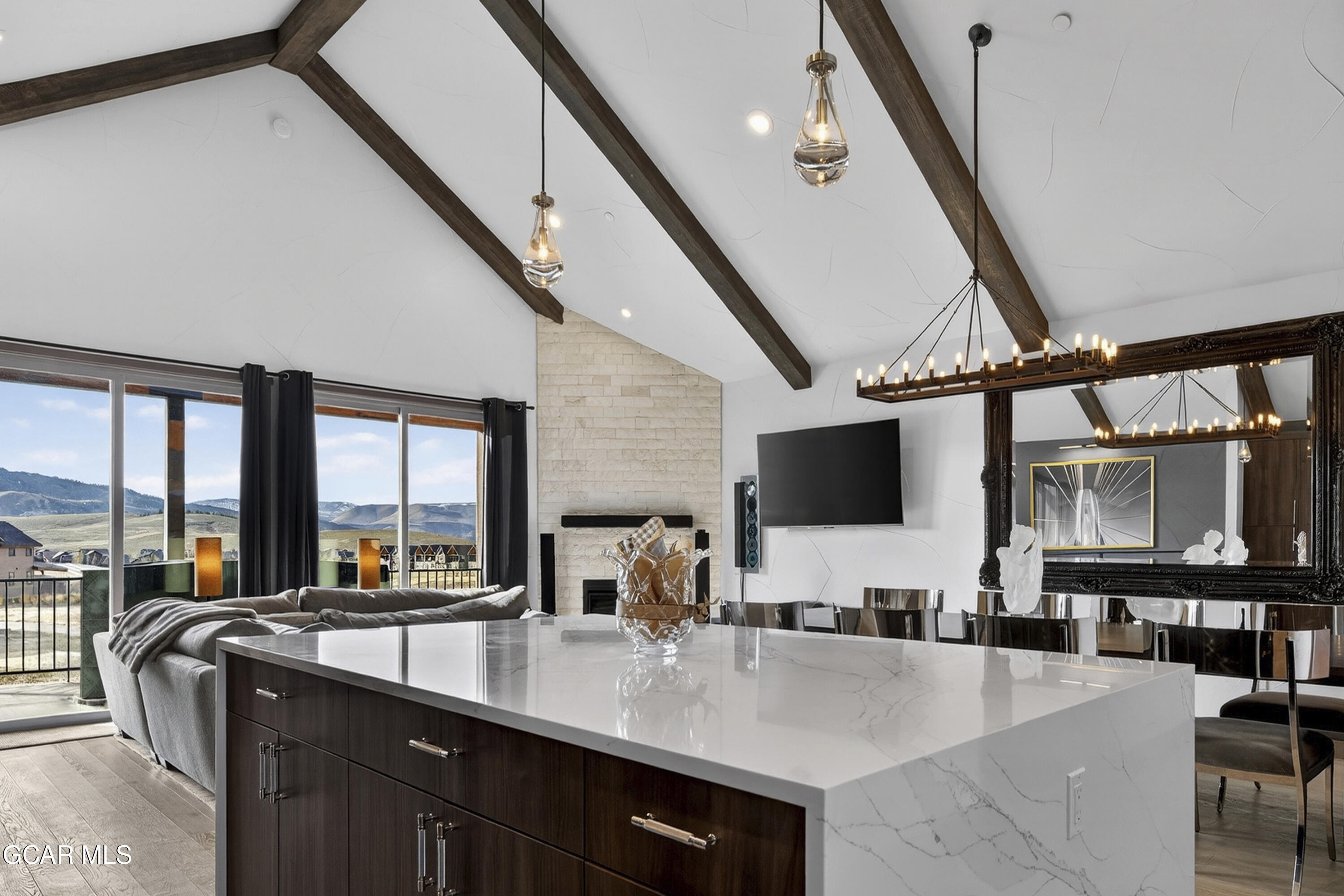 a kitchen with a sink a counter top space and stainless steel appliances