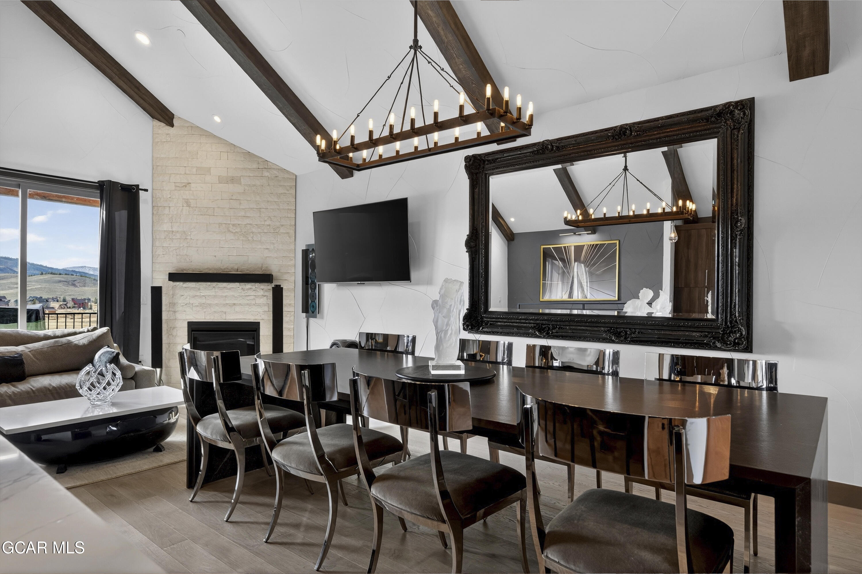 178 Eagle Ridge Drive Granby, CO 80446 - Photo 11 of 45 a living room with furniture a fireplace and a flat screen tv