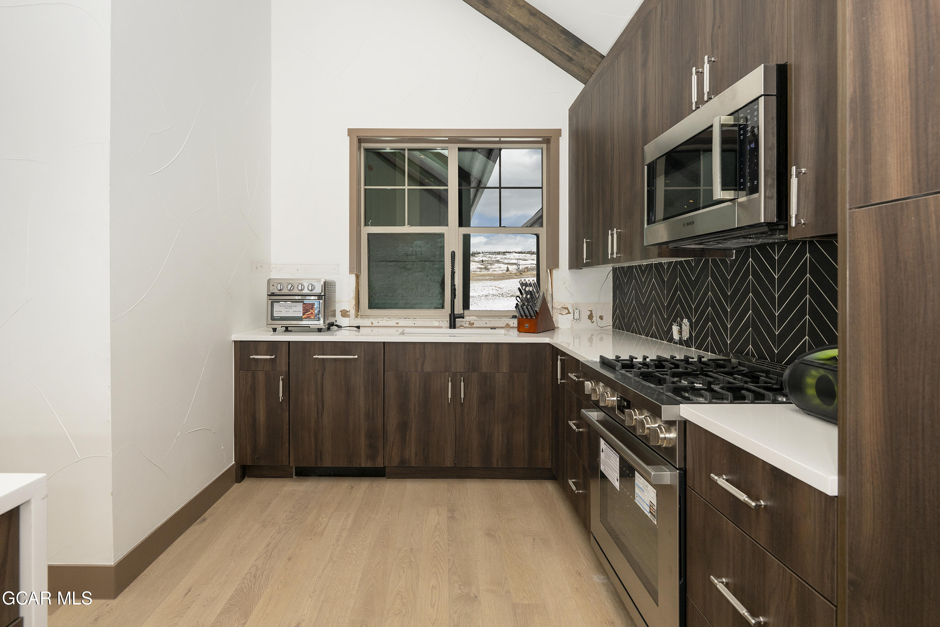 178 Eagle Ridge Drive Granby, CO 80446 - Photo 14 of 45 a kitchen with a stove and a microwave