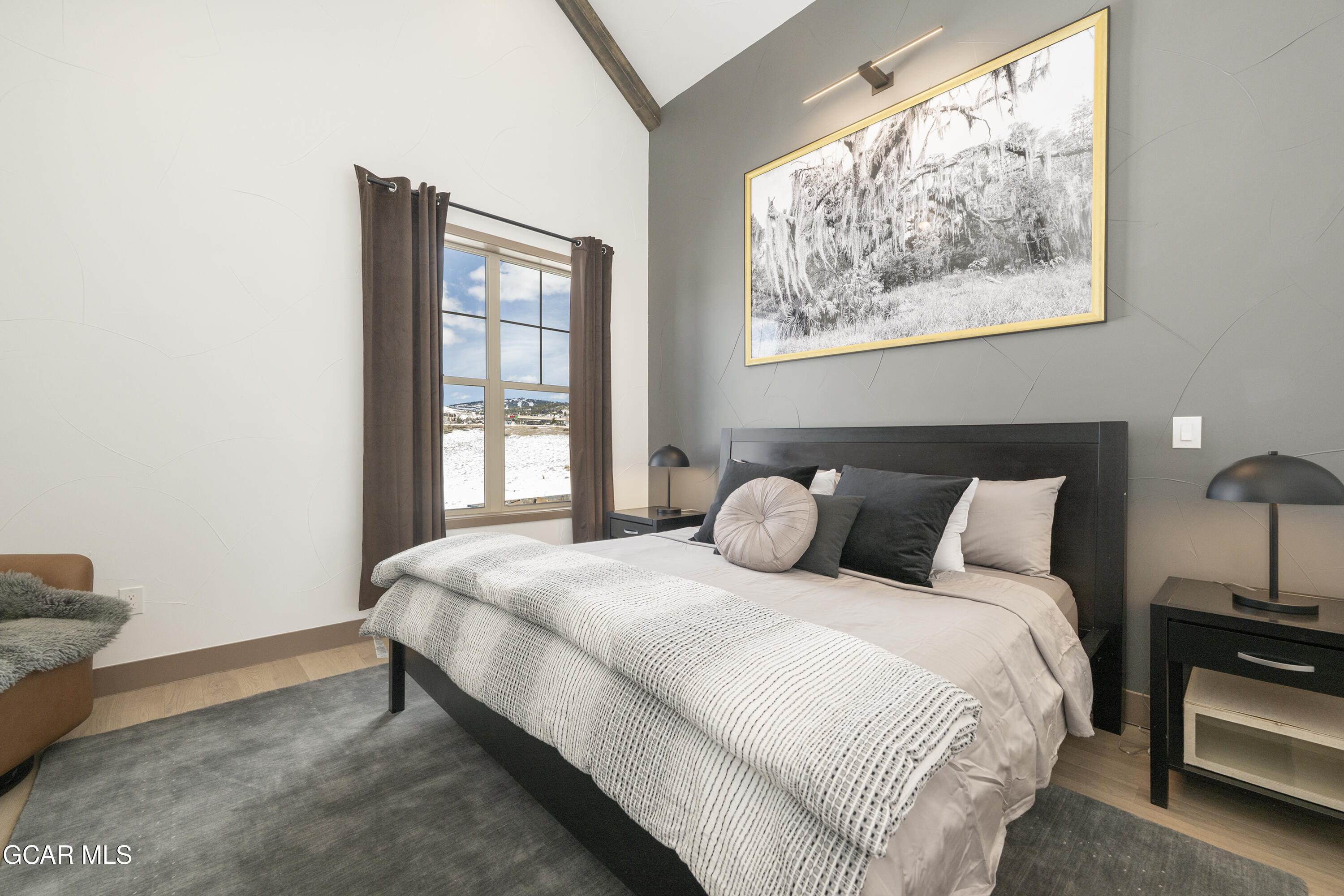 178 Eagle Ridge Drive Granby, CO 80446 - Photo 19 of 45 a bedroom with a bed and a window