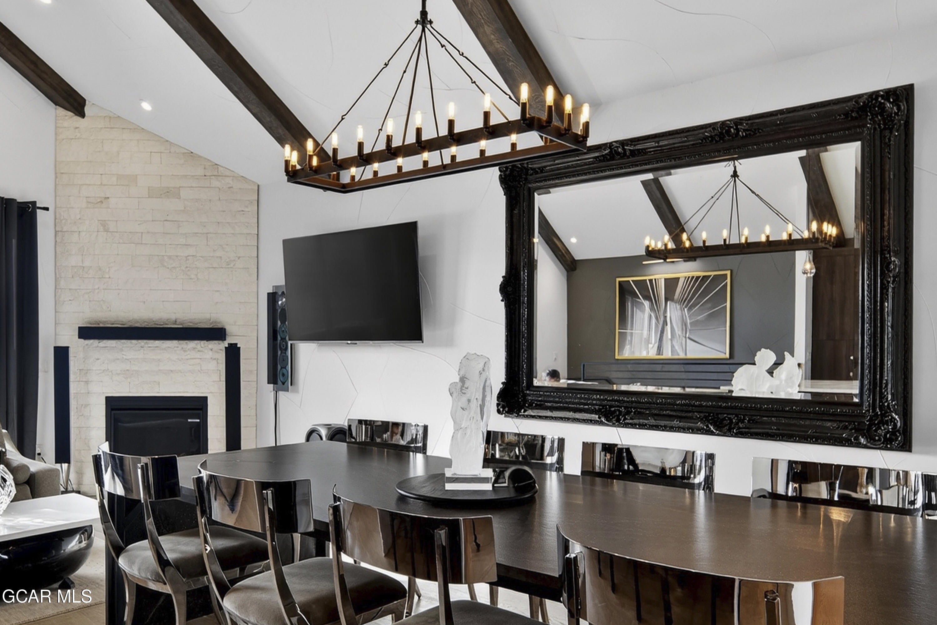 178 Eagle Ridge Drive Granby, CO 80446 - Photo 2 of 45 a living room with furniture a flat screen tv and a fireplace