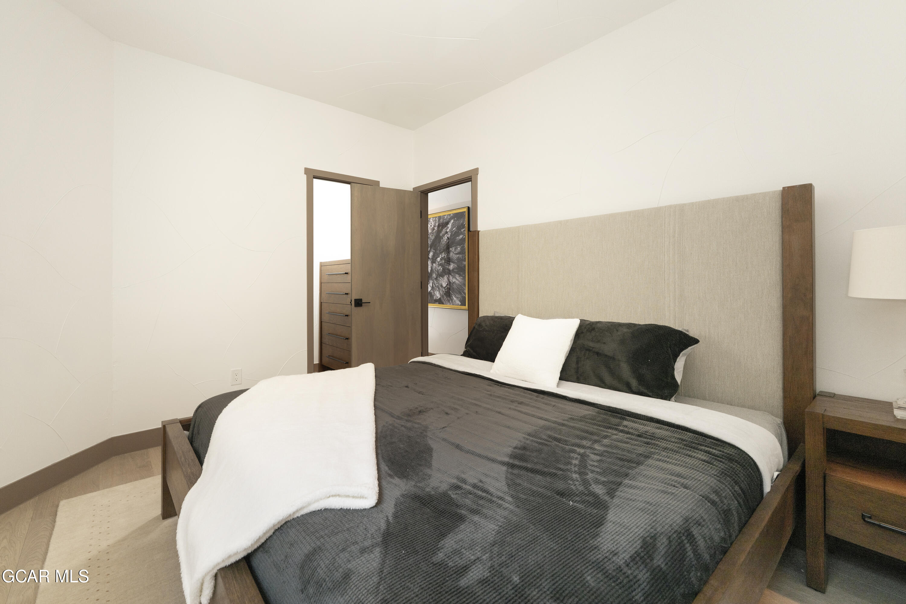 178 Eagle Ridge Drive Granby, CO 80446 - Photo 23 of 45 a bedroom with a bed and chair