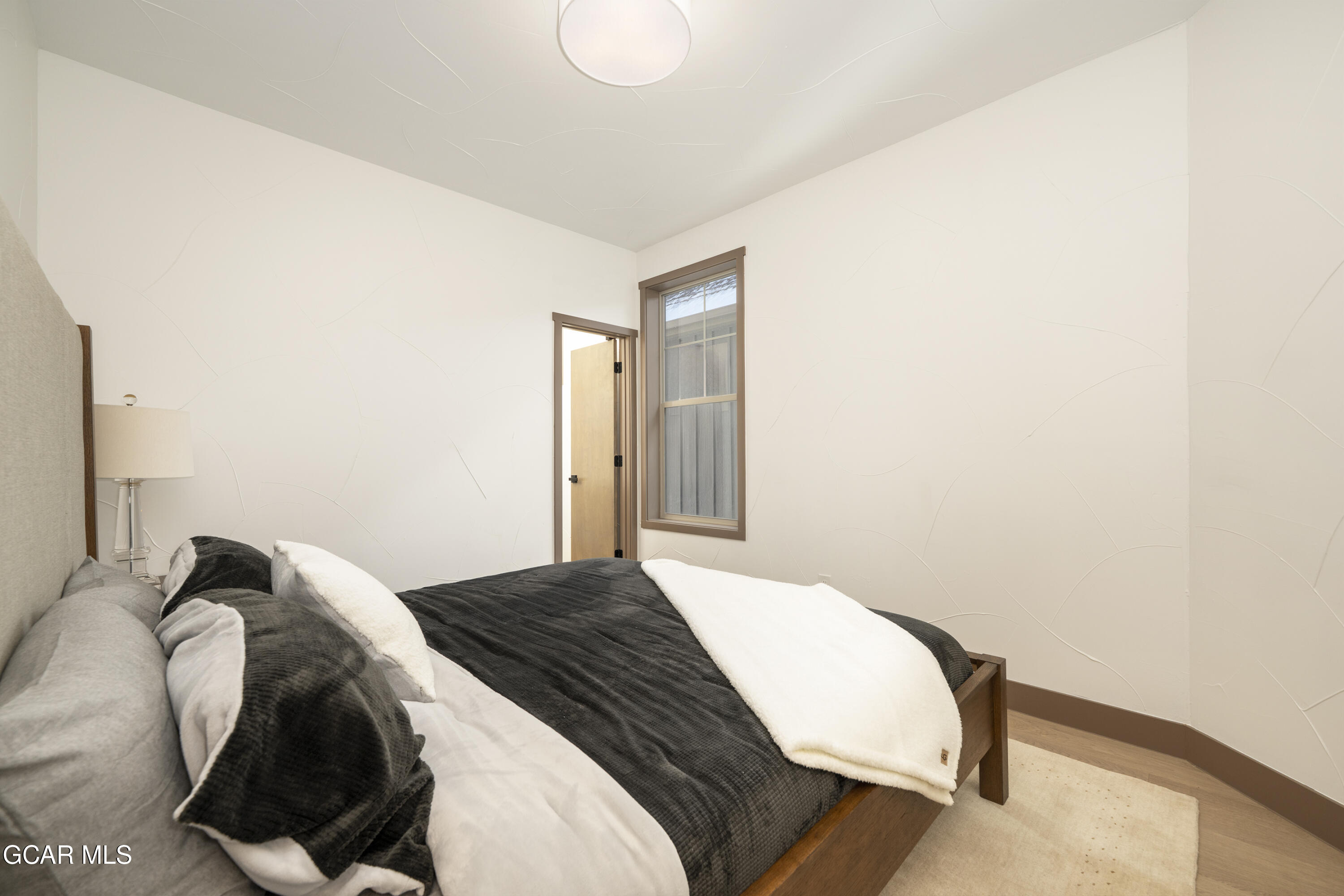 178 Eagle Ridge Drive Granby, CO 80446 - Photo 24 of 45 a bedroom with a bed and a painting on the wall