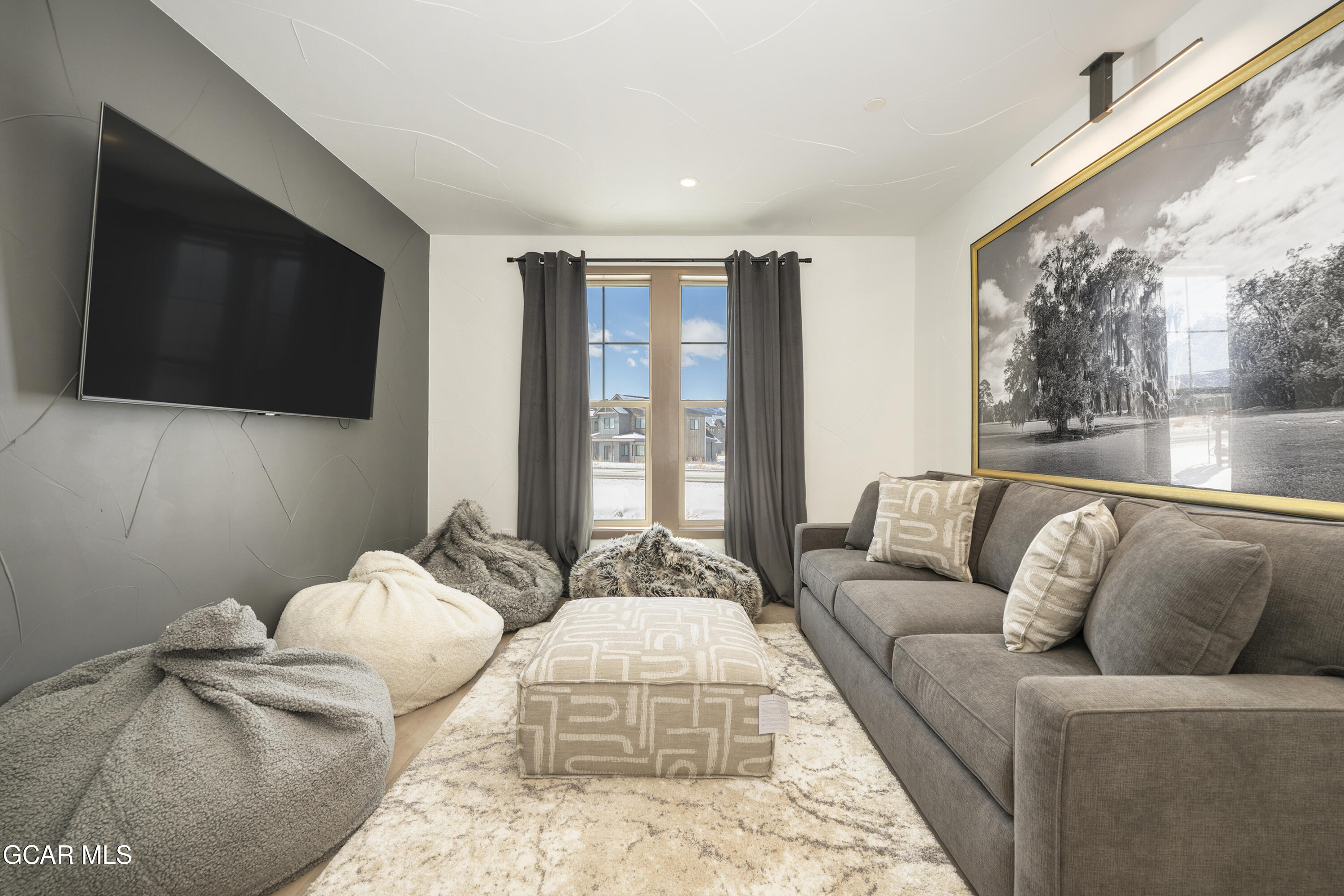 178 Eagle Ridge Drive Granby, CO 80446 - Photo 30 of 45 a living room with furniture and a flat screen tv