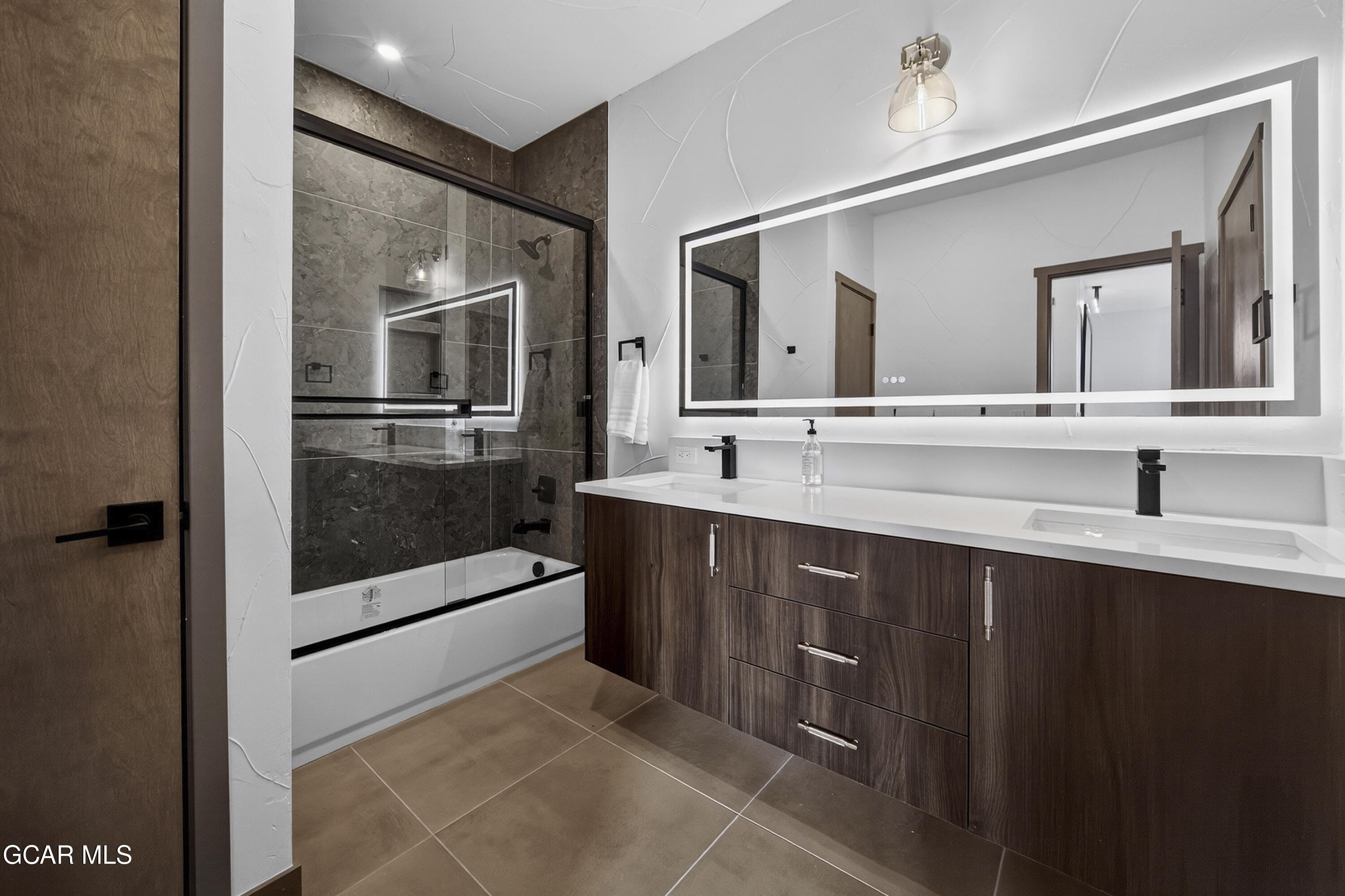 178 Eagle Ridge Drive Granby, CO 80446 - Photo 33 of 45 a spacious bathroom with a sink mirror and