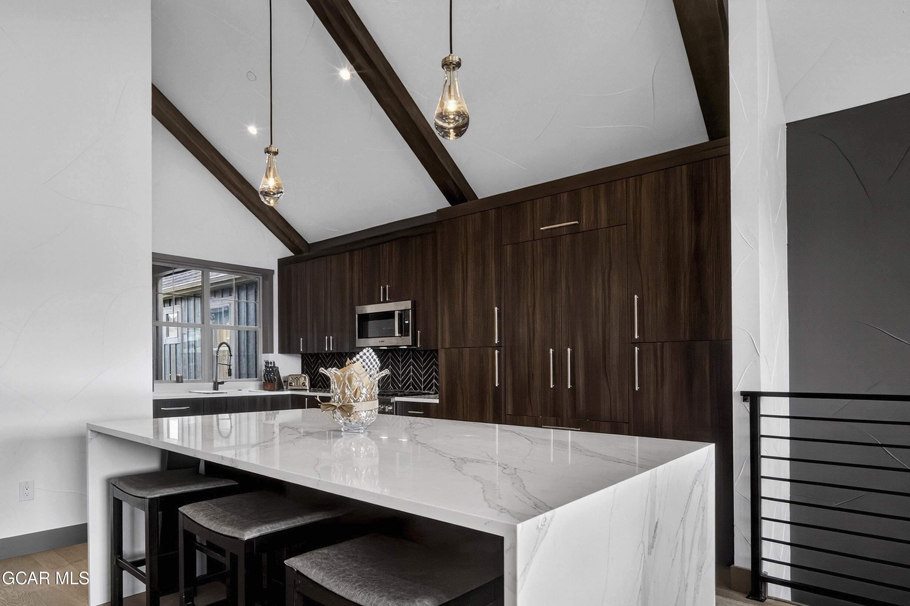 178 Eagle Ridge Drive Granby, CO 80446 - Photo 5 of 45 a kitchen with a table chairs and a refrigerator