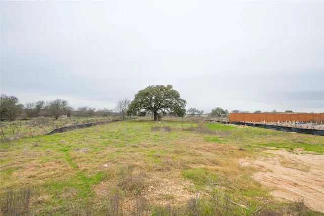 a view of a lake with houses in the back