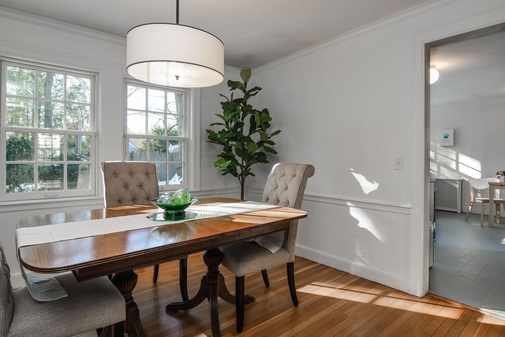 382 Woodland Road Brookline, MA 02467 - Photo 4 of 13 a view of a dining room with furniture window and wooden floor