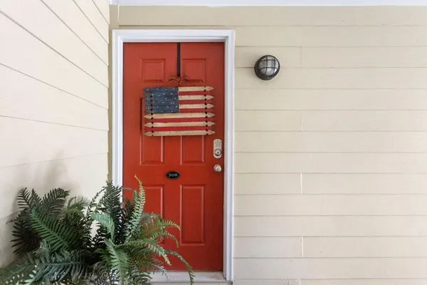 a view of a door and wooden floor