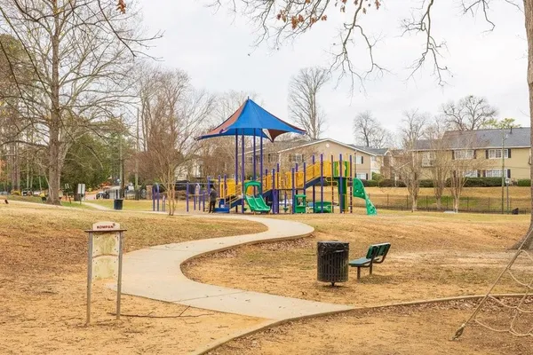 a park bench sitting in the middle of a park