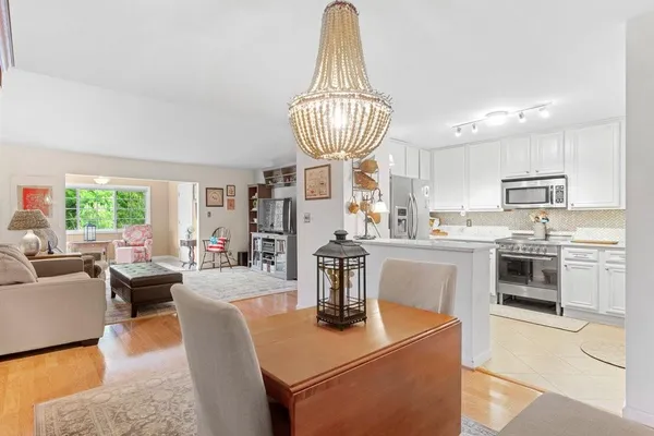 a kitchen with counter top space appliances and windows