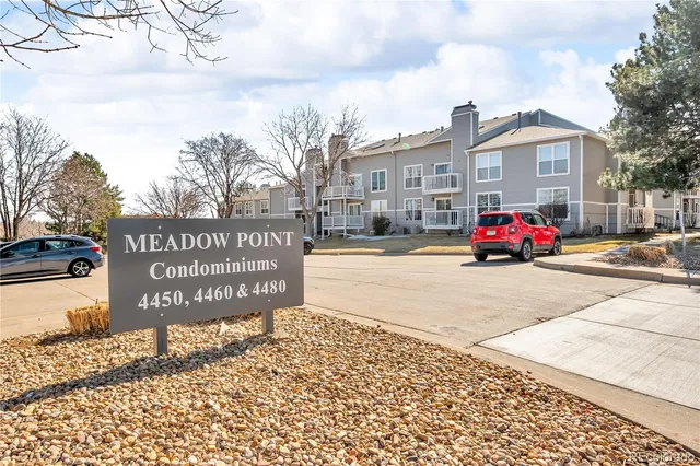 a front view of a building with sign board
