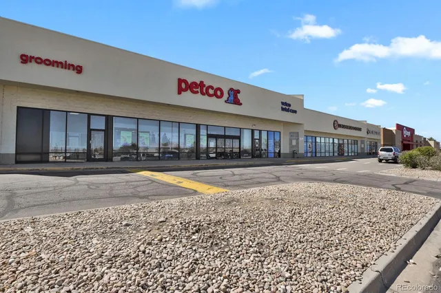 a swimming pool with outdoor seating
