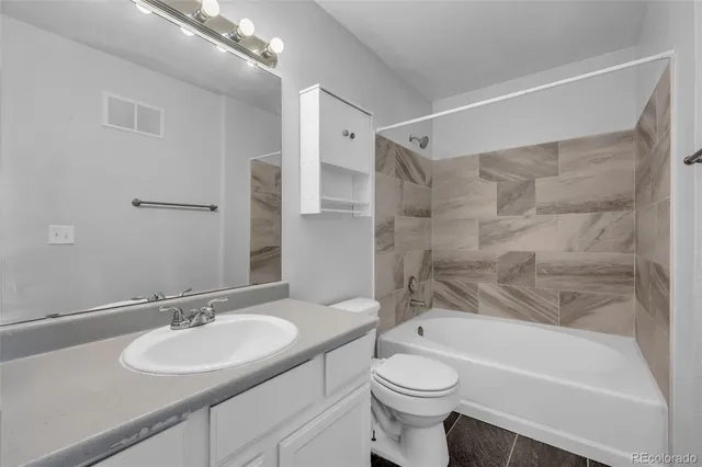 a bathroom with a sink a toilet and a bathtub