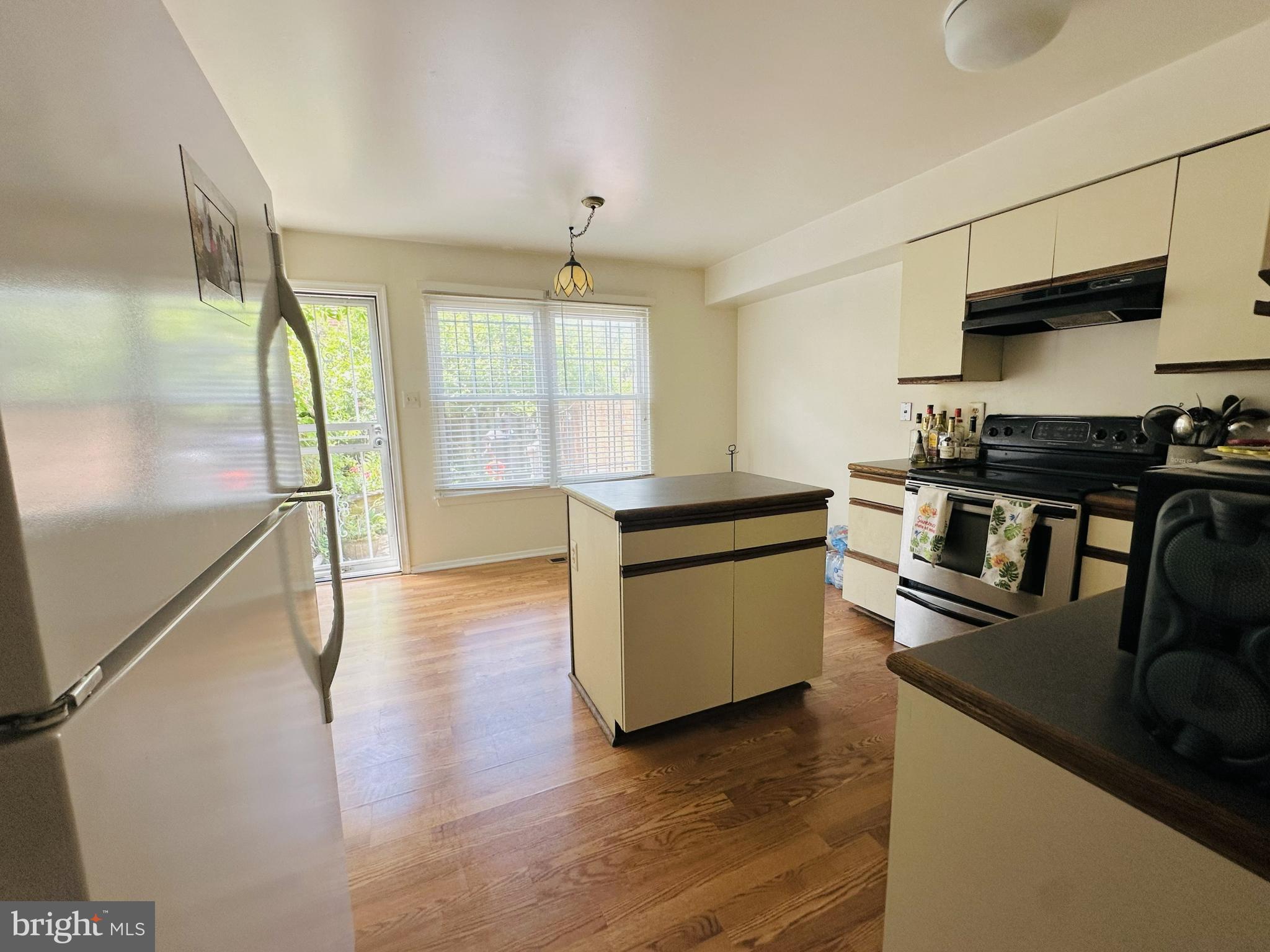 28 North Wolfe Street Baltimore, MD 21231 - Photo 10 of 25 a kitchen with stainless steel appliances a stove sink and refrigerator