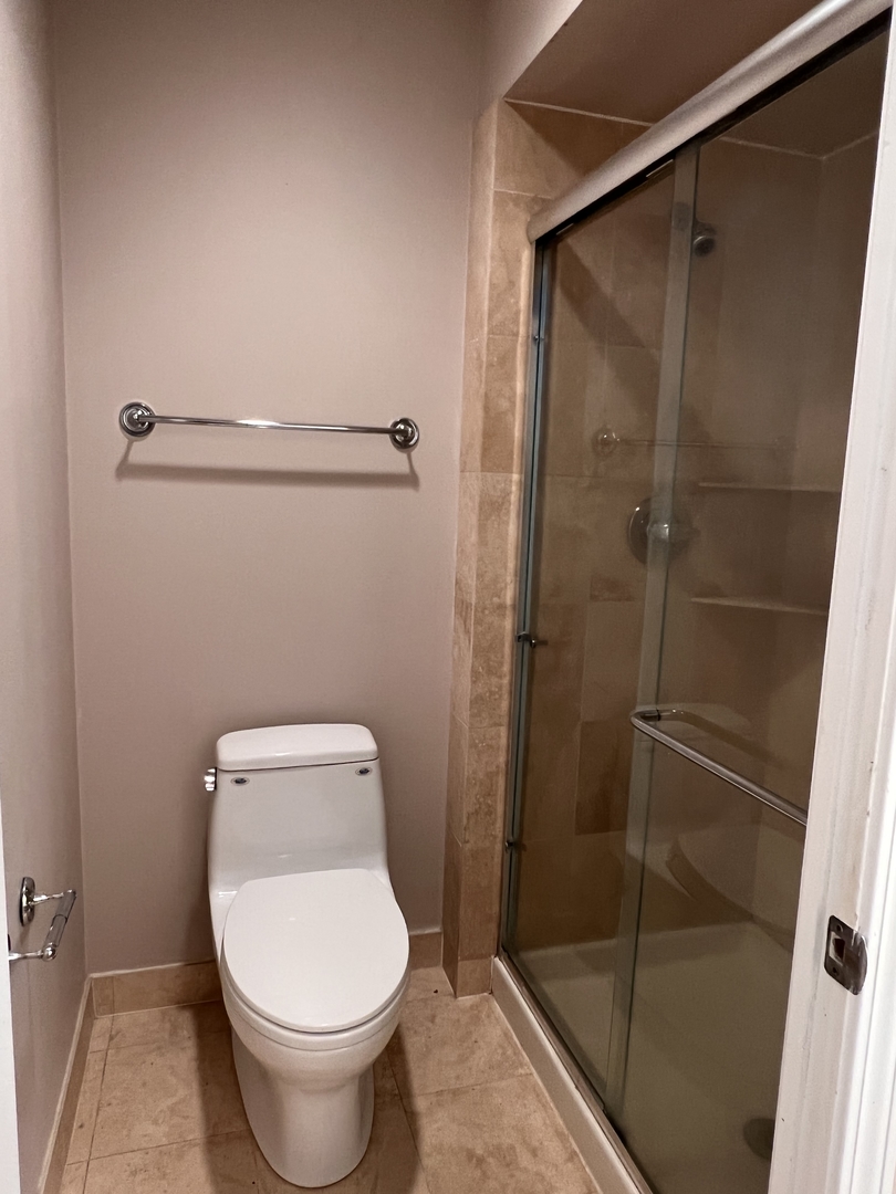 6102 North Sheridan Road, Unit 201 Chicago, IL 60660 - Photo 11 of 15 a bathroom with a toilet and a shower