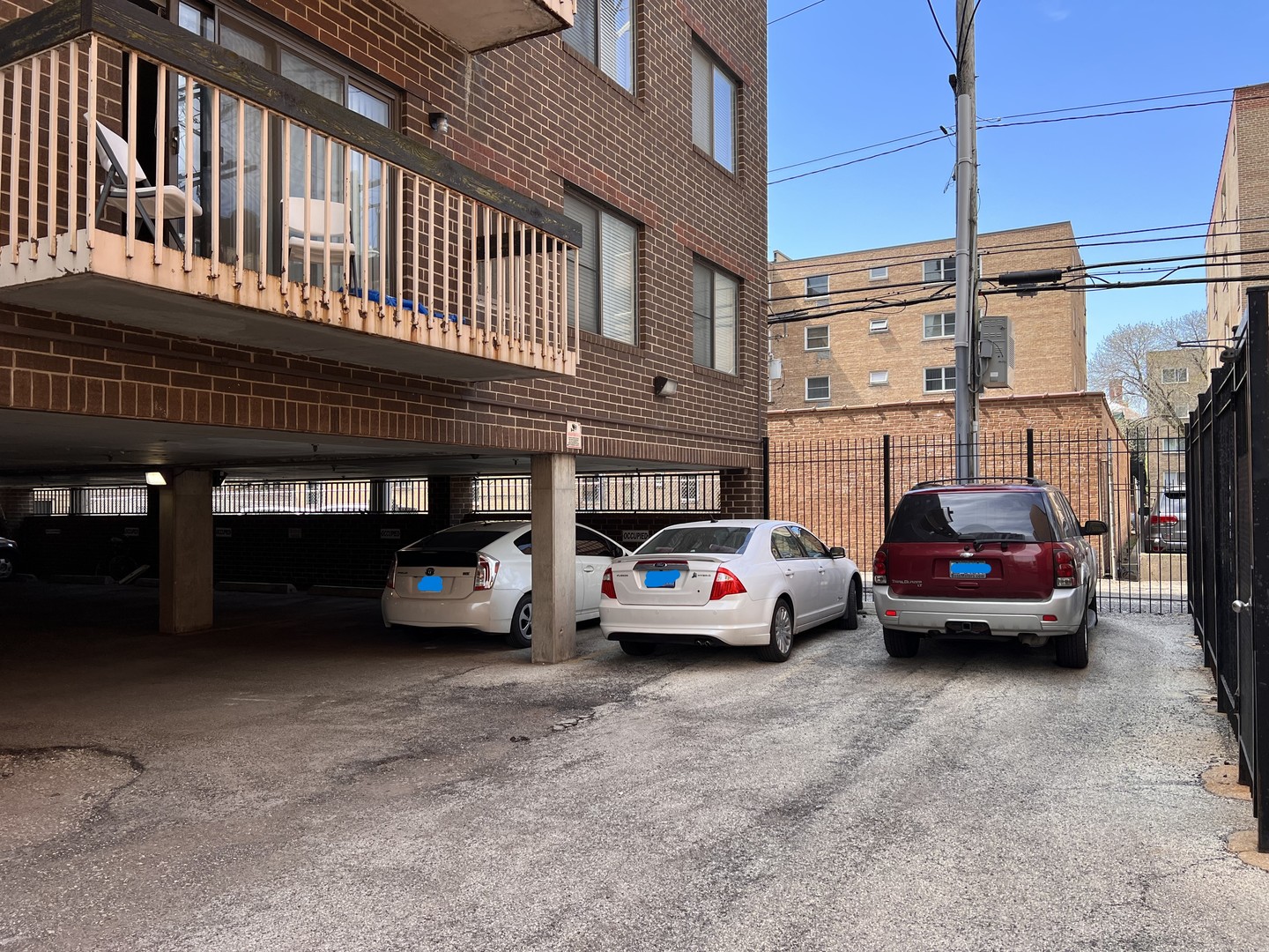 6102 North Sheridan Road, Unit 201 Chicago, IL 60660 - Photo 12 of 15 a car parked in front of a building