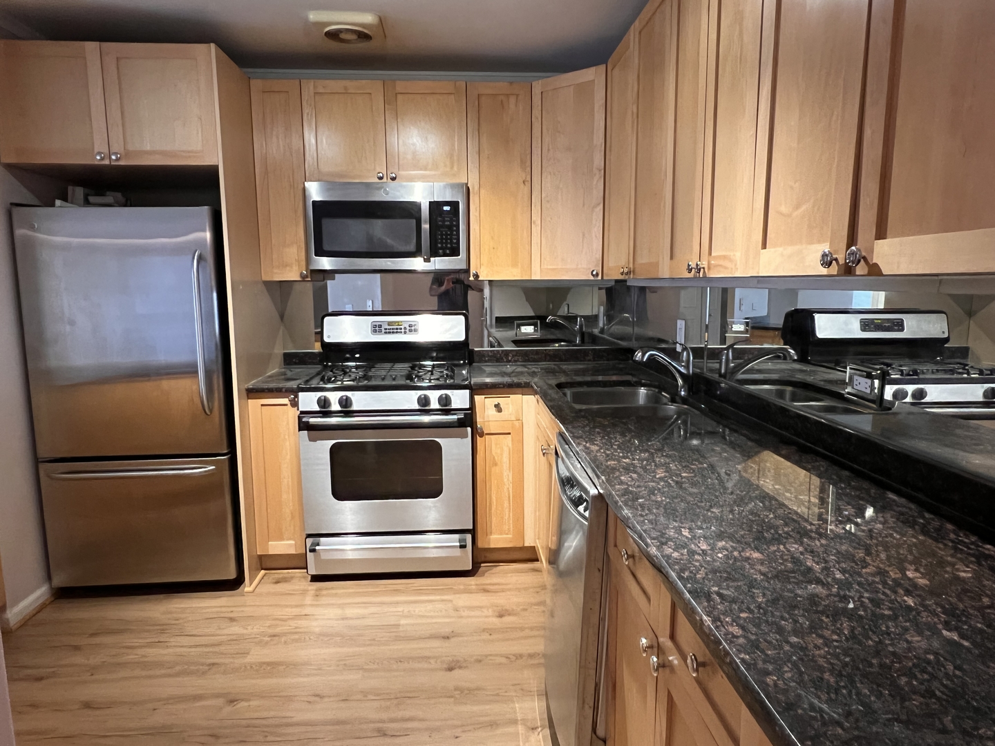 6102 North Sheridan Road, Unit 201 Chicago, IL 60660 - Photo 3 of 15 a kitchen with a sink and steel appliances