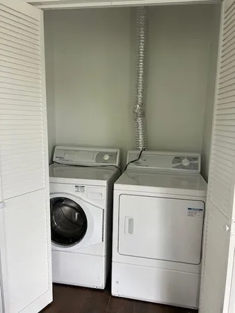 a utility room with dryer and washer