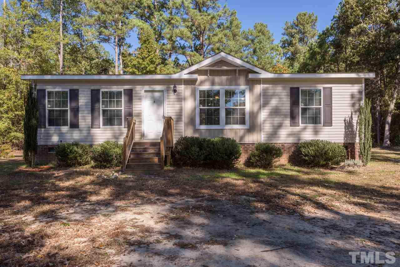 1001 Altice Drive Raleigh, NC 27603 - Photo 1 of 24 a front view of a house with a yard