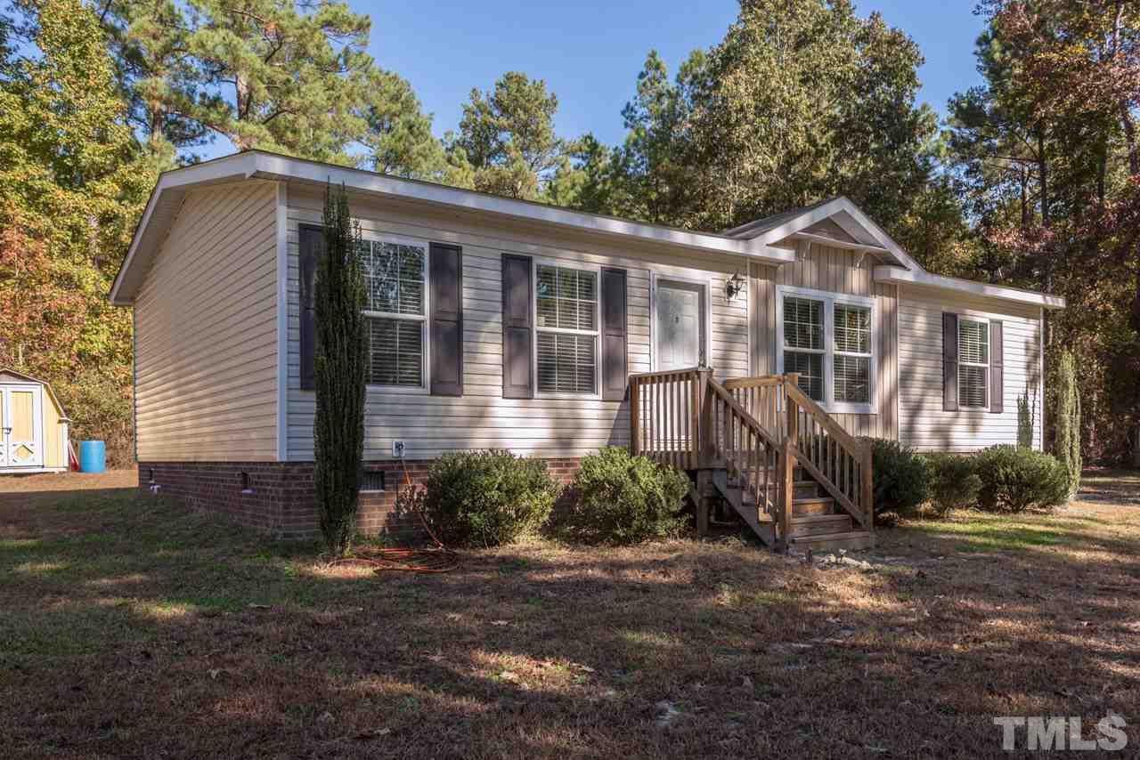1001 Altice Drive Raleigh, NC 27603 - Photo 2 of 24 a front view of a house with garden
