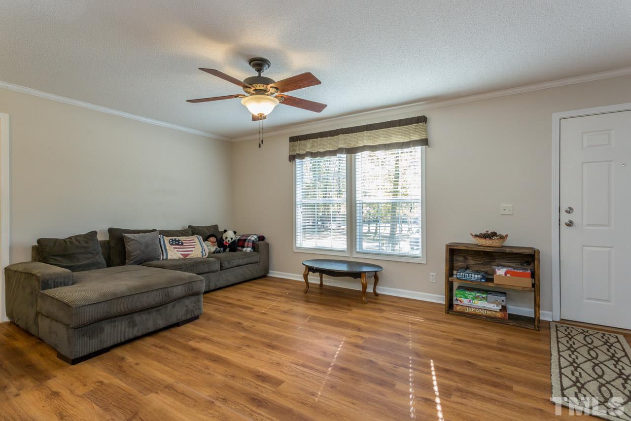 1001 Altice Drive Raleigh, NC 27603 - Photo 11 of 24 a living room with furniture and a window