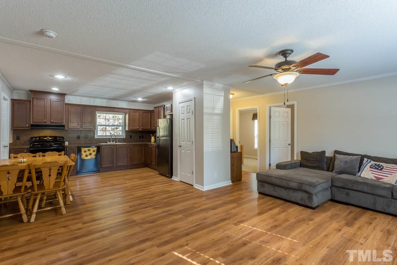 1001 Altice Drive Raleigh, NC 27603 - Photo 12 of 24 a living room with furniture and kitchen view