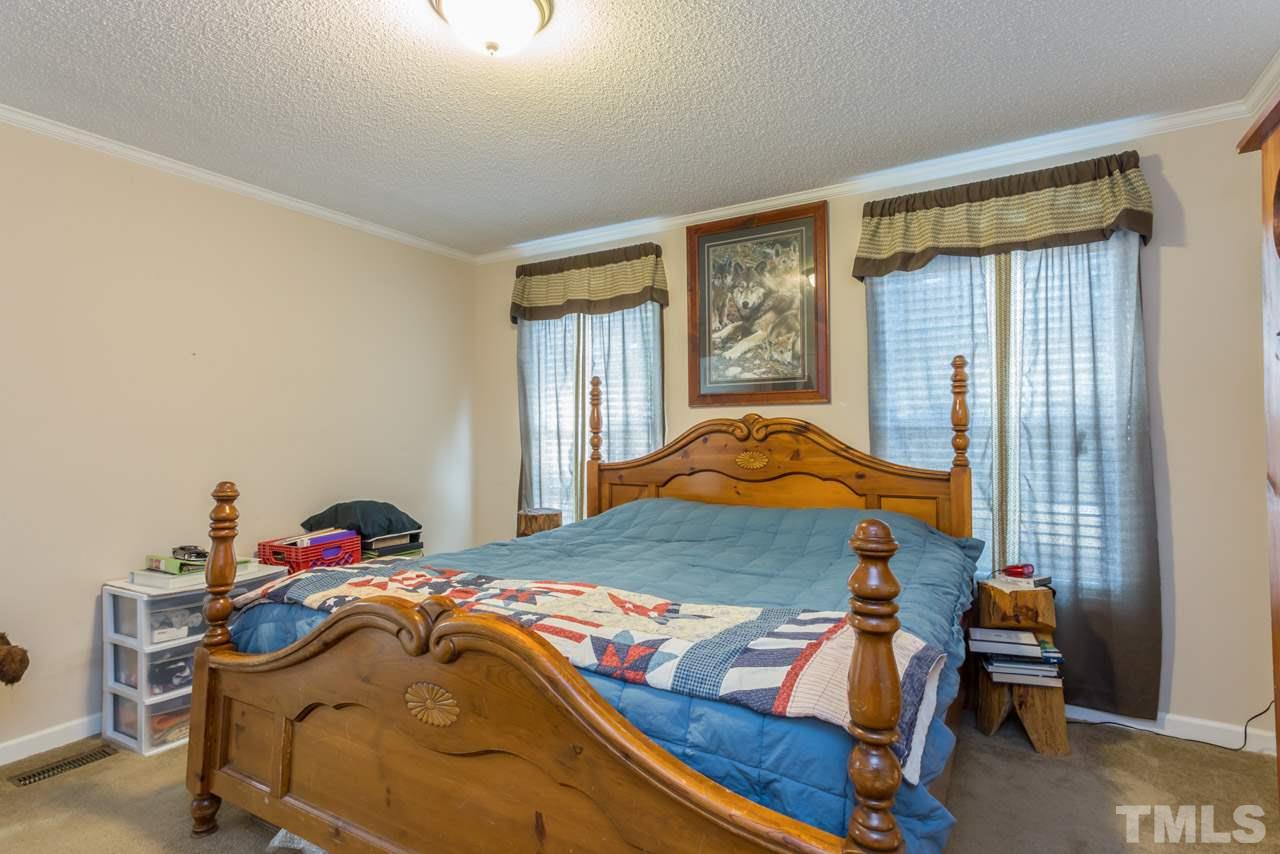 1001 Altice Drive Raleigh, NC 27603 - Photo 19 of 24 a bedroom with a bed and a window