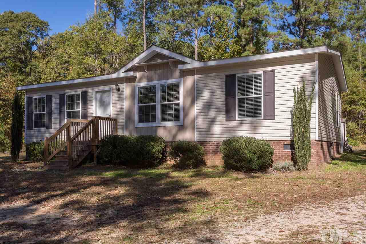 1001 Altice Drive Raleigh, NC 27603 - Photo 3 of 24 a front view of a house with garden