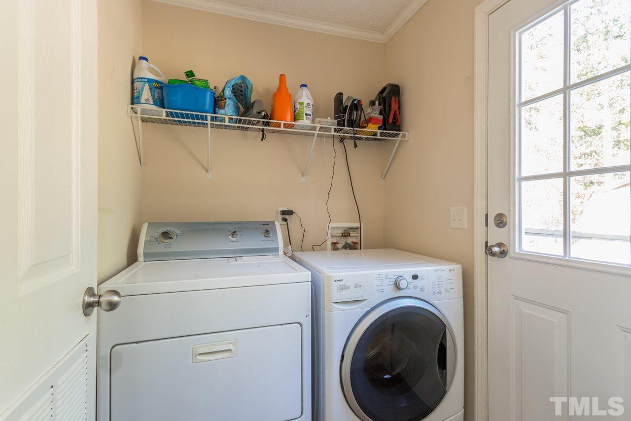 1001 Altice Drive Raleigh, NC 27603 - Photo 24 of 24 a view of washer and dryer with bathroom in the background