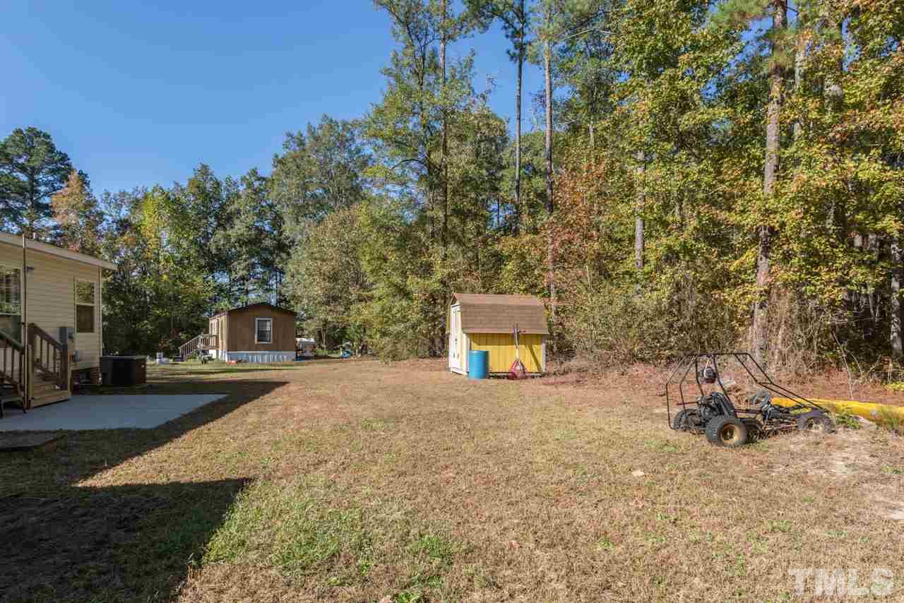 1001 Altice Drive Raleigh, NC 27603 - Photo 6 of 24 a view of a house with a yard