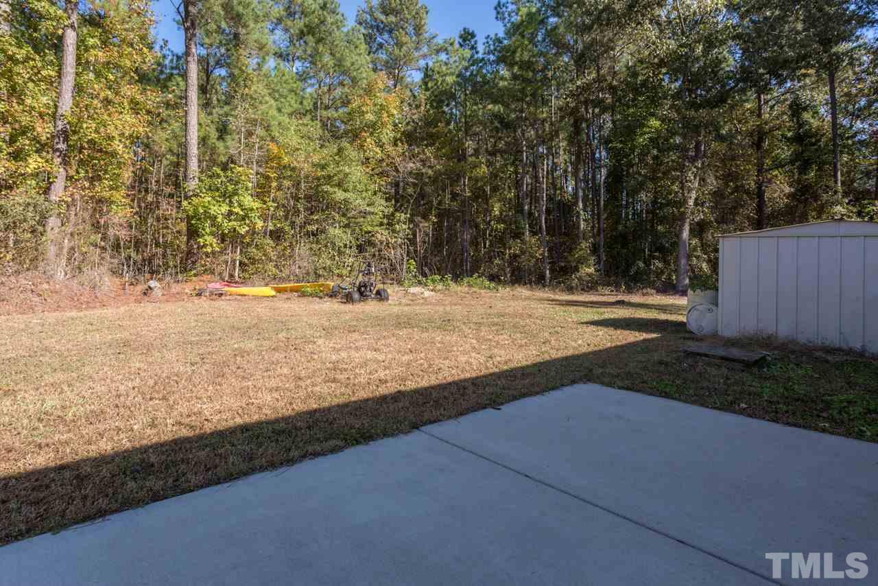 1001 Altice Drive Raleigh, NC 27603 - Photo 7 of 24 a view of yard with wooden fence