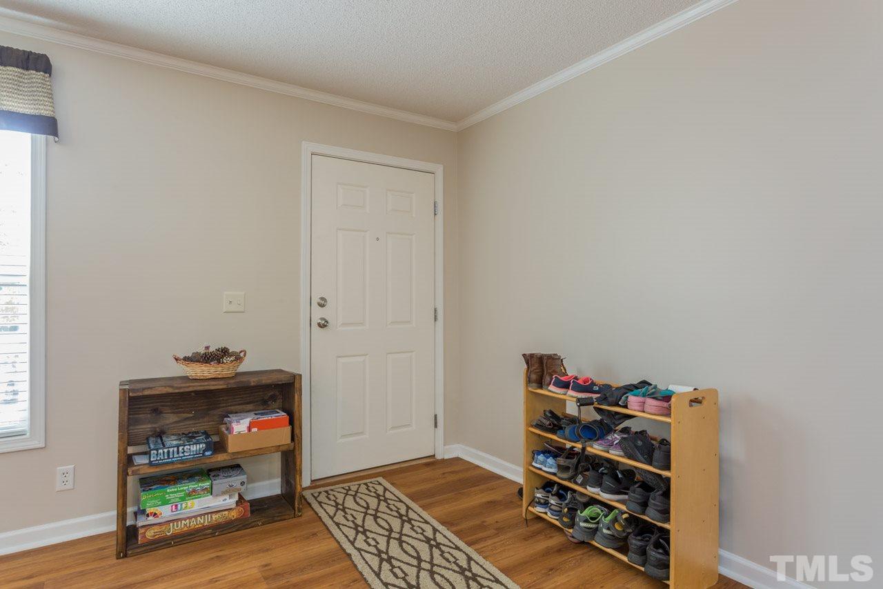 1001 Altice Drive Raleigh, NC 27603 - Photo 10 of 24 a room with furniture and wooden floor