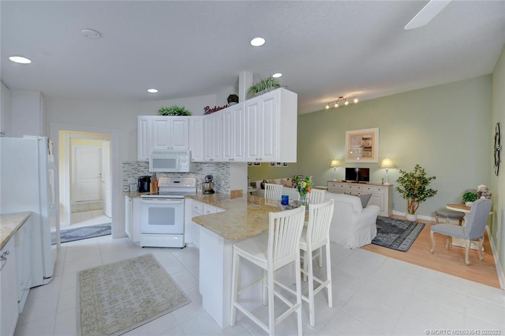 786 Southwest Balmoral Trace Stuart, FL 34997 - Photo 9 of 35 Kitchen and Living Room