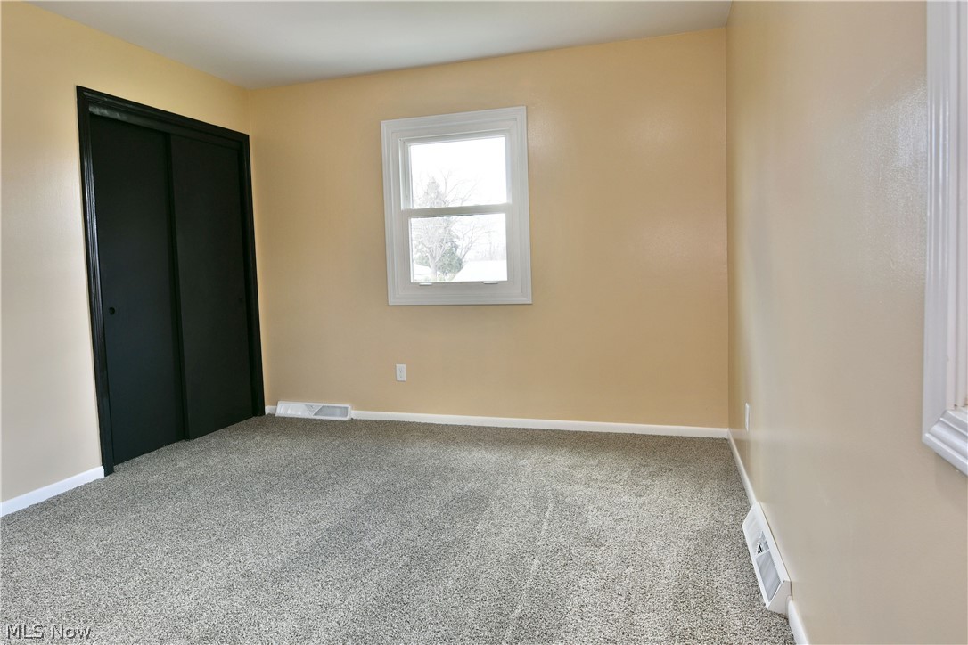 105 Fairview Avenue Cortland, OH 44410 - Photo 30 of 47 Unfurnished bedroom with light carpet and a closet