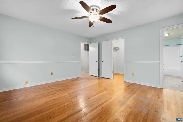 a kitchen with stainless steel appliances a refrigerator sink and wooden cabinets