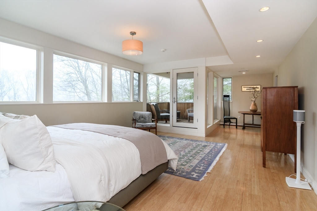 41 Grove Street Wayland, MA 01778 - Photo 16 of 24 a bed room with a bed and a large window