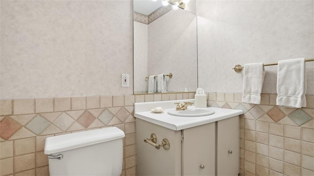 1160 Bower Hill Road, Unit 716A Mt. Lebanon, PA 15243 - Photo 10 of 36 Entry level powder room w/ ceramic tile & neutral wall paper.