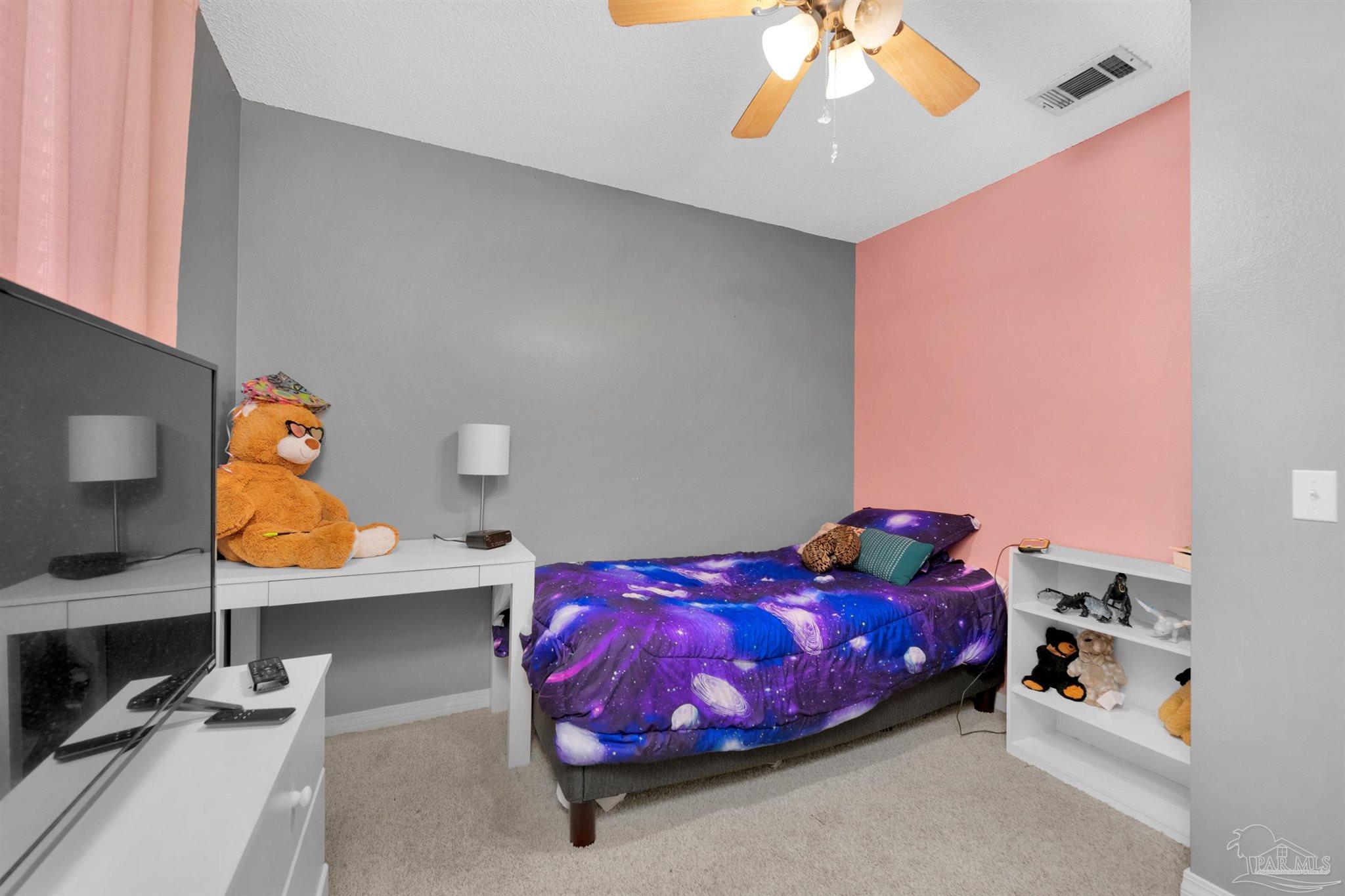 2702 Beacon Court Navarre, FL 32566 - Photo 21 of 29 a bedroom with a bed and window