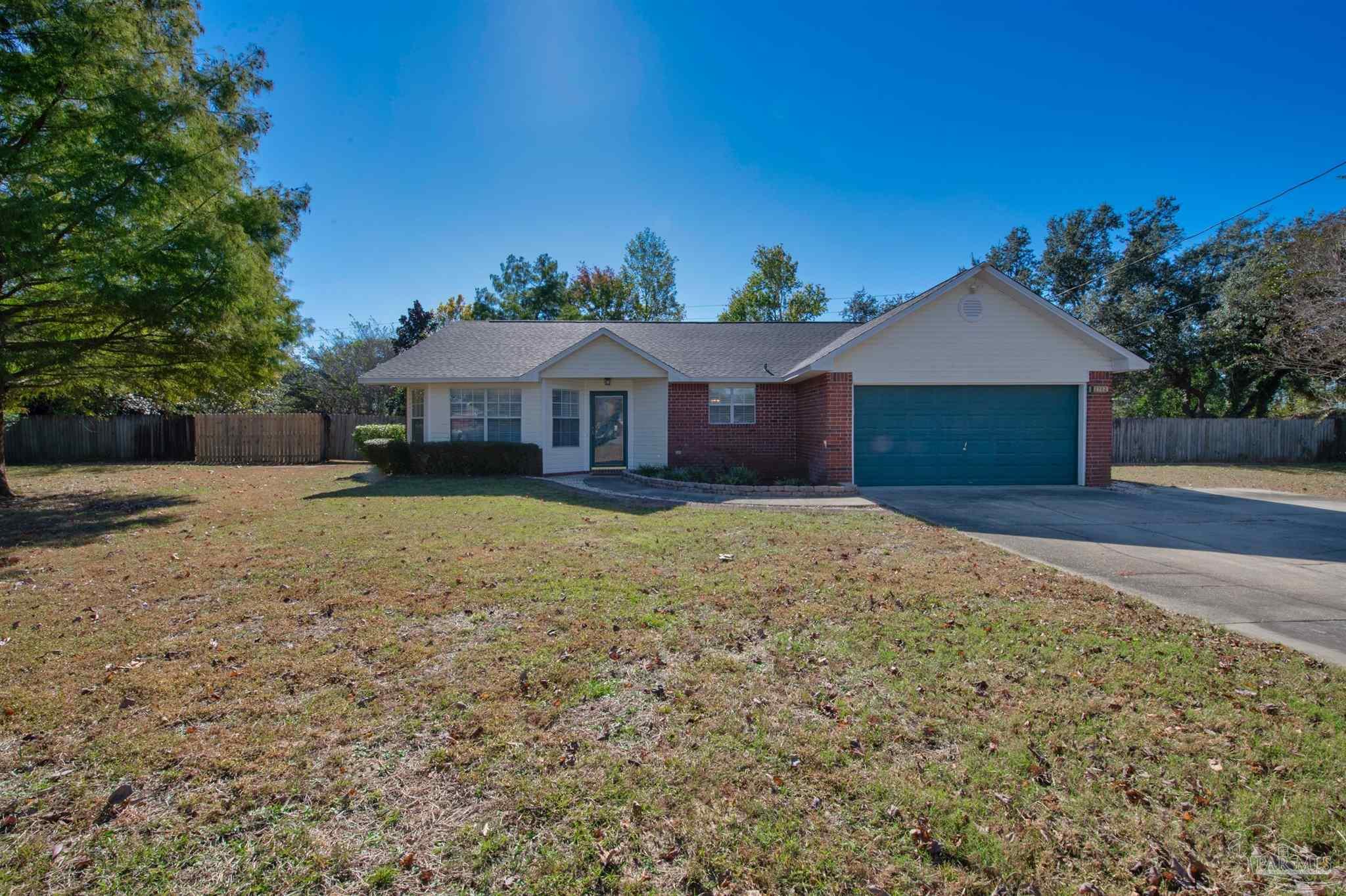 2702 Beacon Court Navarre, FL 32566 - Photo 4 of 29 front view of a house with a yard