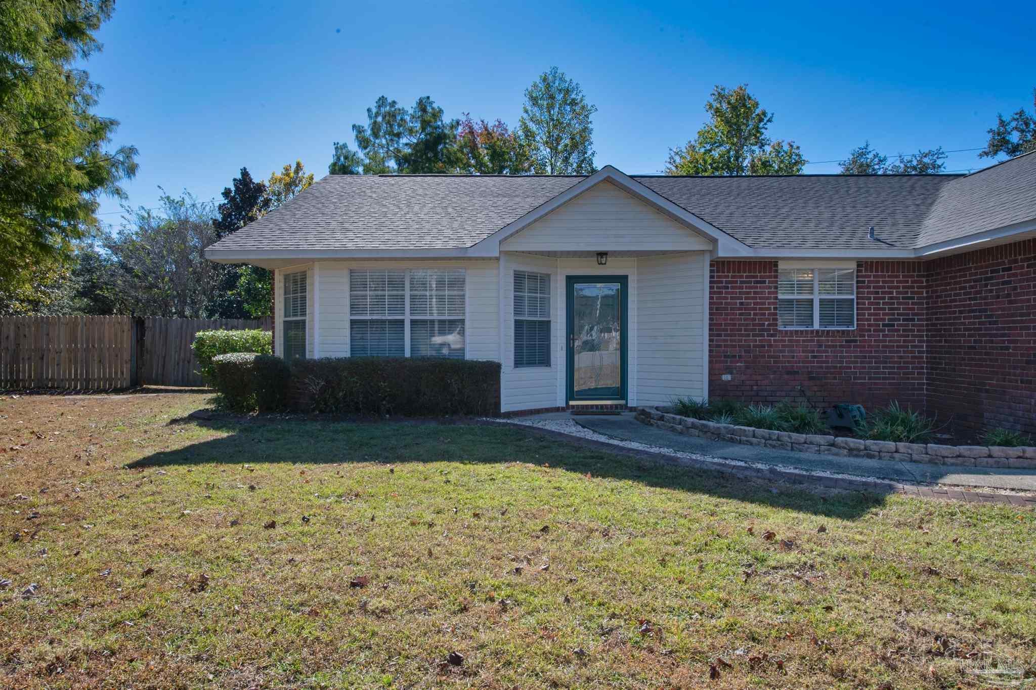2702 Beacon Court Navarre, FL 32566 - Photo 5 of 29 a view of a house with a yard