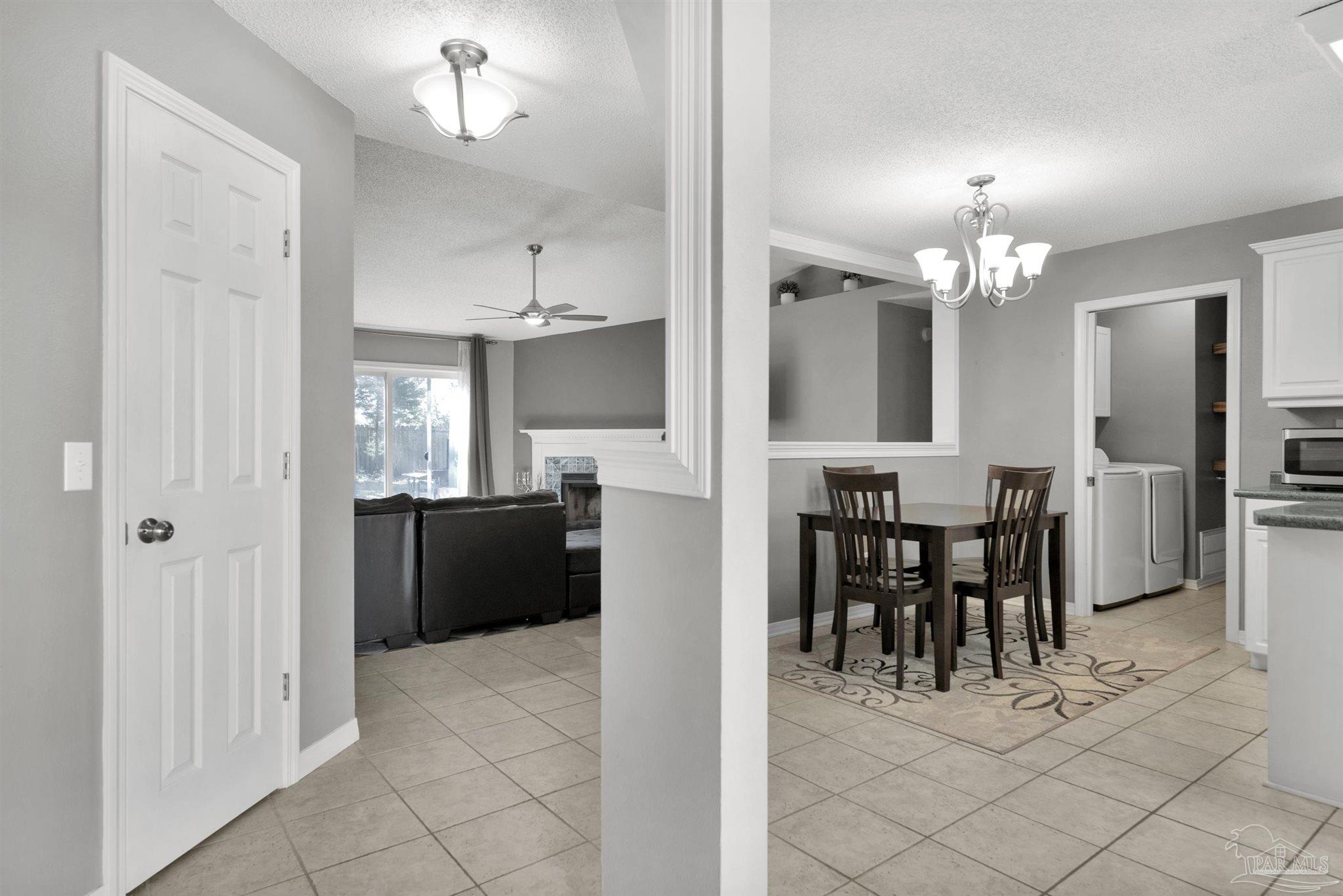 2702 Beacon Court Navarre, FL 32566 - Photo 6 of 29 a view of a dining room kitchen and entryway