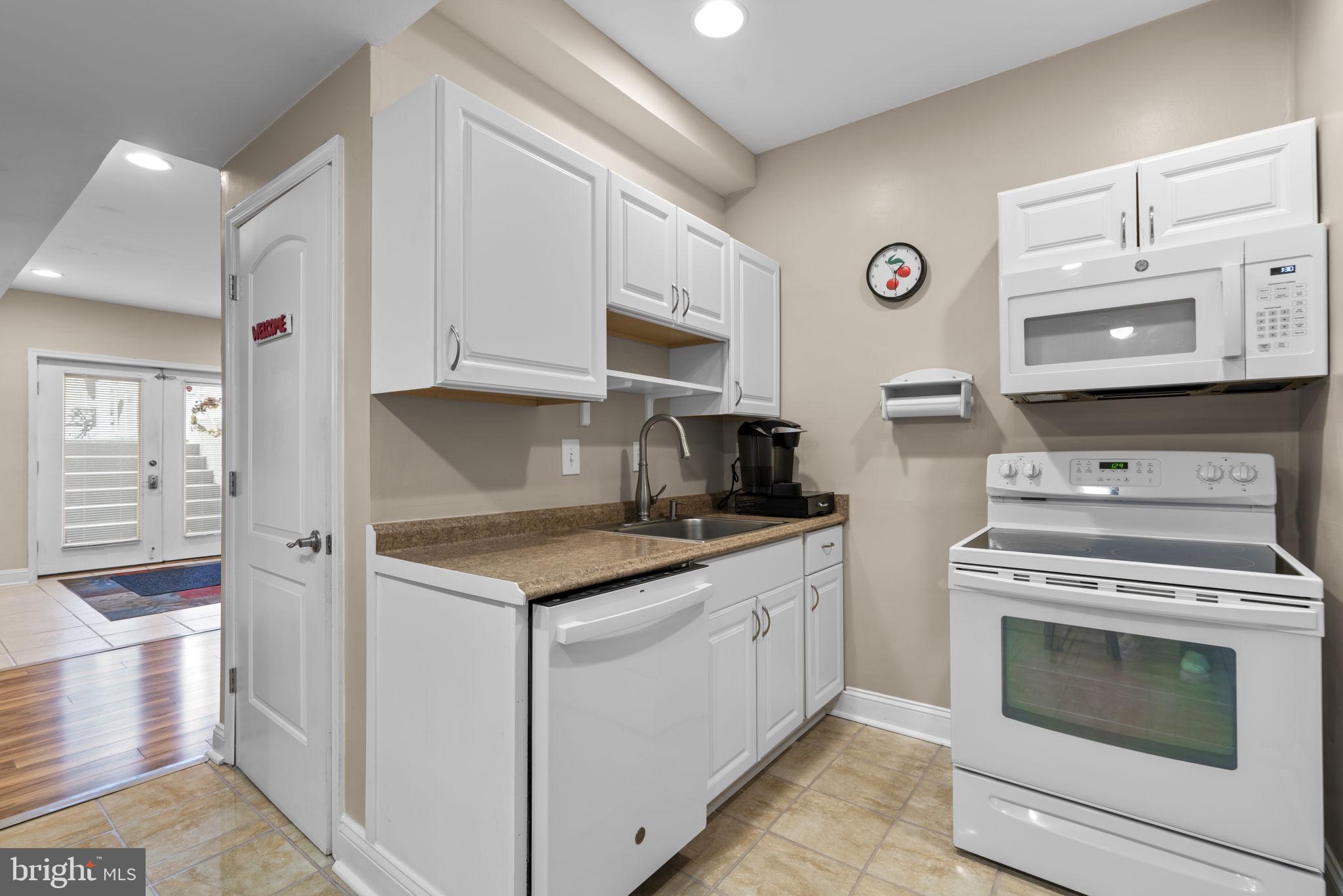 8024 Solley Road Glen Burnie, MD 21060 - Photo 59 of 83 a kitchen with granite countertop cabinets stainless steel appliances and a sink