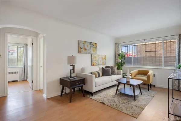a living room with furniture and a large window